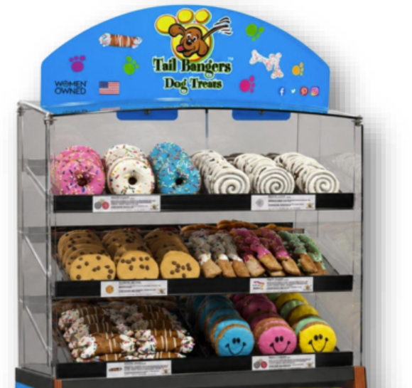 Tail Bangers branded in-store bakery display case stocked with frosted gourmet dog treats